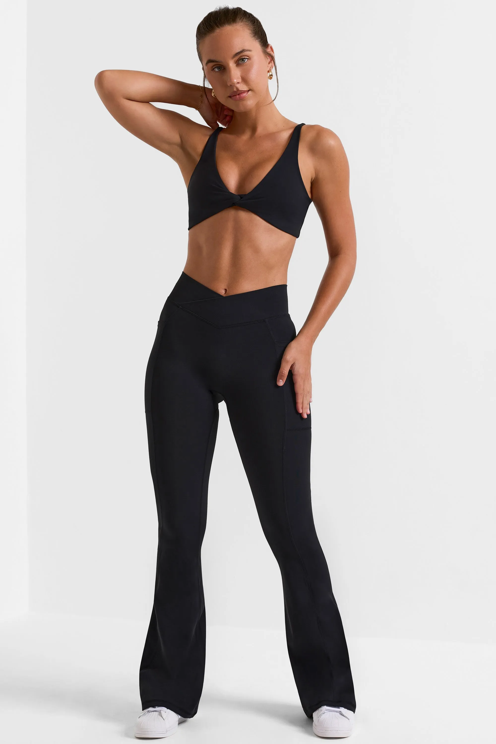 Petite Cross Waistband Flare Pocket Leggings in Black
